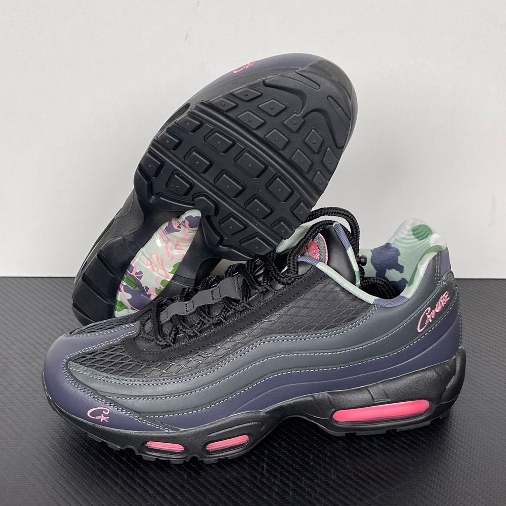 Limited edition Nike Air Max 95 SP x Corteiz (CRTZ RTW) sneaker in Black and Pink Beam, featuring premium leather overlays, netted mesh, and neon pink visible Air units, SKU FB2709-001.