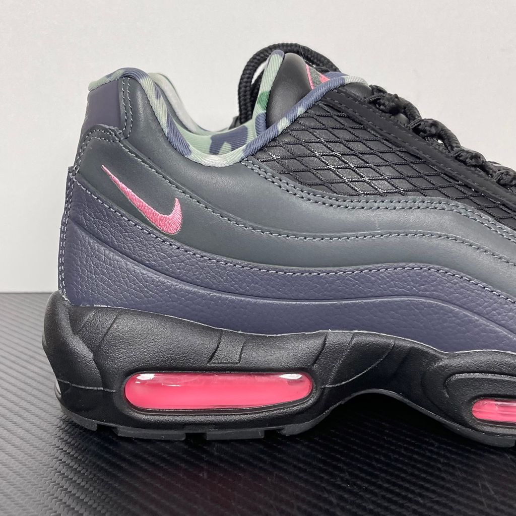 Limited edition Nike Air Max 95 SP x Corteiz (CRTZ RTW) sneaker in Black and Pink Beam, featuring premium leather overlays, netted mesh, and neon pink visible Air units, SKU FB2709-001.
