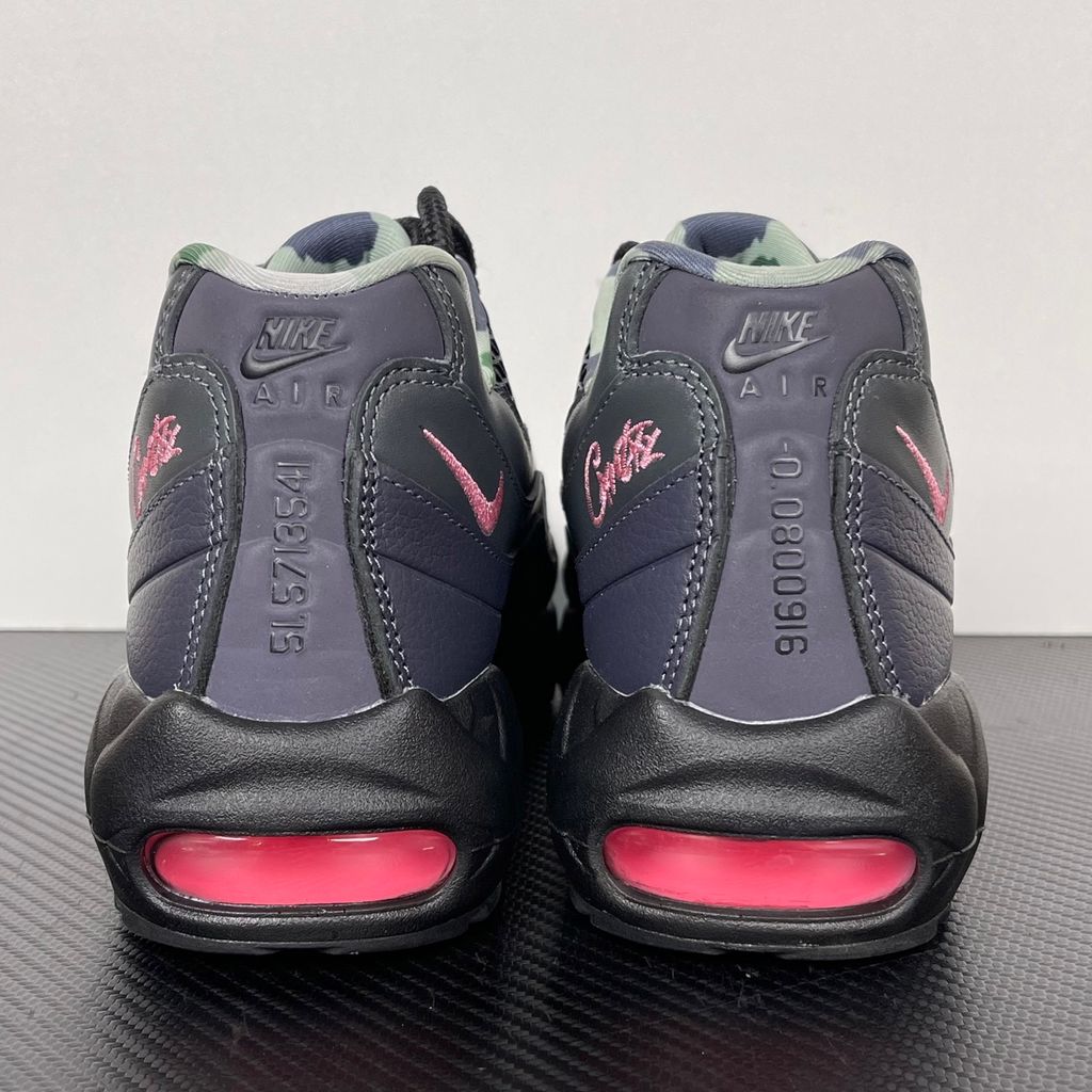 Limited edition Nike Air Max 95 SP x Corteiz (CRTZ RTW) sneaker in Black and Pink Beam, featuring premium leather overlays, netted mesh, and neon pink visible Air units, SKU FB2709-001.