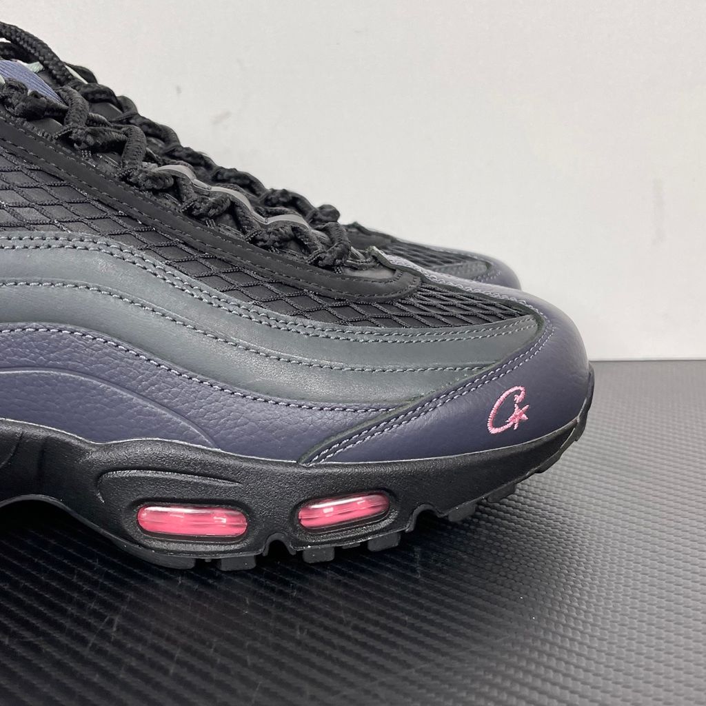 Limited edition Nike Air Max 95 SP x Corteiz (CRTZ RTW) sneaker in Black and Pink Beam, featuring premium leather overlays, netted mesh, and neon pink visible Air units, SKU FB2709-001.