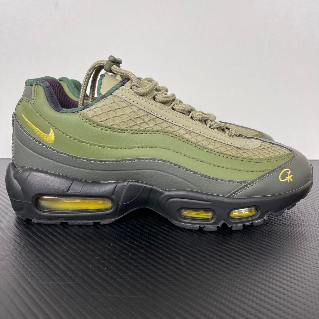 Limited edition Nike Air Max 95 SP x Corteiz (CRTZ RTW) sneaker in Gutta Green and Black, featuring premium olive leather overlays, netted mesh, and vibrant yellow visible Air units, SKU FB2709-300.