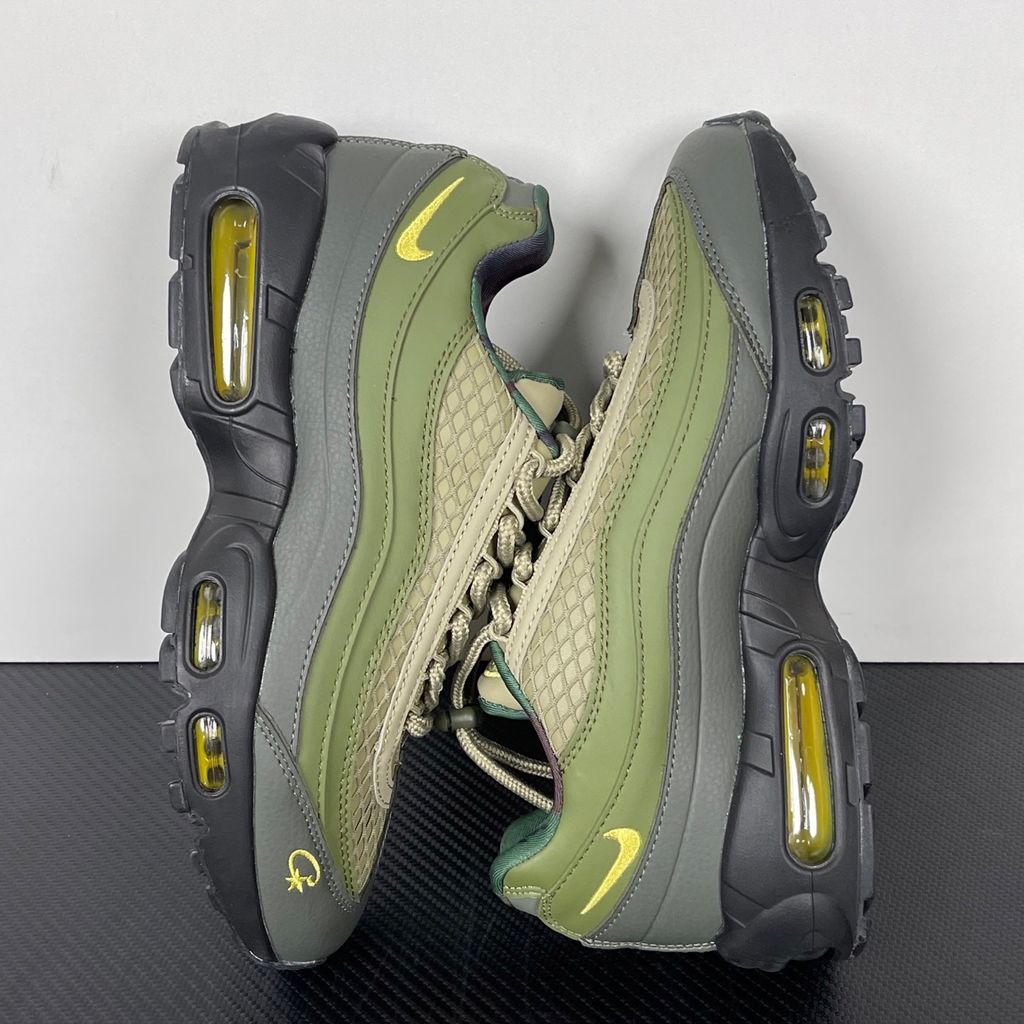 Limited edition Nike Air Max 95 SP x Corteiz (CRTZ RTW) sneaker in Gutta Green and Black, featuring premium olive leather overlays, netted mesh, and vibrant yellow visible Air units, SKU FB2709-300.