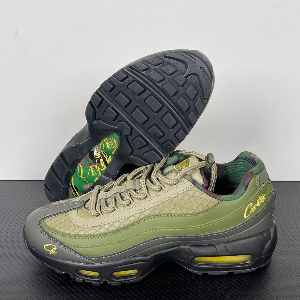 Limited edition Nike Air Max 95 SP x Corteiz (CRTZ RTW) sneaker in Gutta Green and Black, featuring premium olive leather overlays, netted mesh, and vibrant yellow visible Air units, SKU FB2709-300.