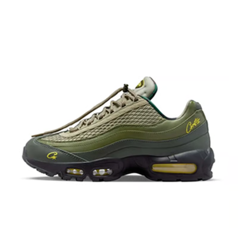 Limited edition Nike Air Max 95 SP x Corteiz (CRTZ RTW) sneaker in Gutta Green and Black, featuring premium olive leather overlays, netted mesh, and vibrant yellow visible Air units, SKU FB2709-300.
