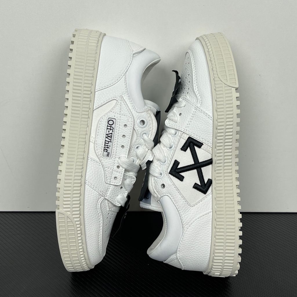 Off-White 3.0 Off Court Low sneaker in pure white tumbled calfskin leather, featuring black industrial label detailing, classic Off-White side typography, and a thick ribbed rubber midsole, SKU 0010110.