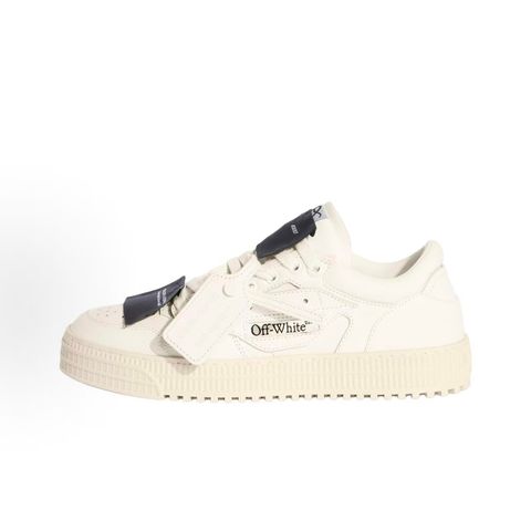 Off-White 3.0 Off Court Low sneaker in pure white tumbled calfskin leather, featuring black industrial label detailing, classic Off-White side typography, and a thick ribbed rubber midsole, SKU 0010110.