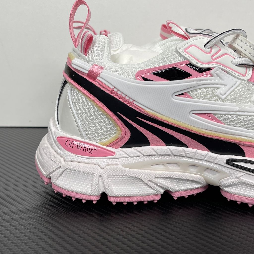 Off-White Be Right Back runner sneaker in a white, pink, and black colorway, featuring breathable mesh, dynamic synthetic overlays, the signature arrow logo, and a white zip-tie tag.