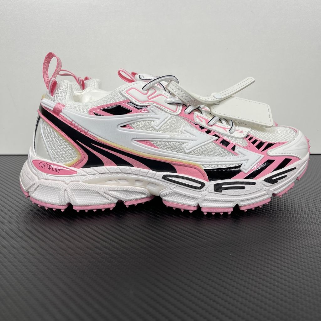 Off-White Be Right Back runner sneaker in a white, pink, and black colorway, featuring breathable mesh, dynamic synthetic overlays, the signature arrow logo, and a white zip-tie tag.