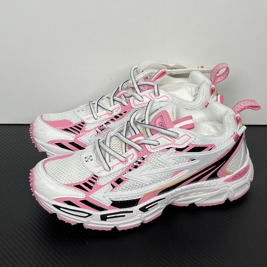 Off-White Be Right Back runner sneaker in a white, pink, and black colorway, featuring breathable mesh, dynamic synthetic overlays, the signature arrow logo, and a white zip-tie tag.