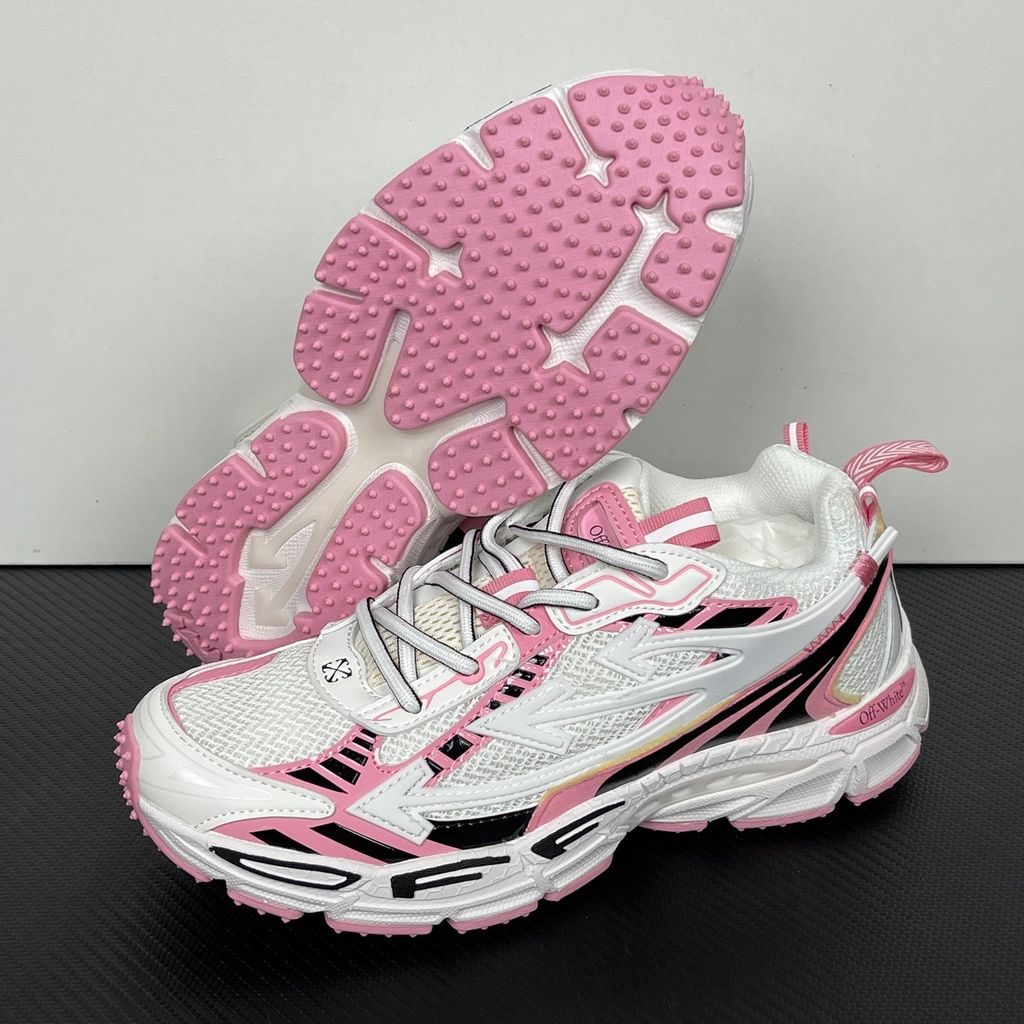 Off-White Be Right Back runner sneaker in a white, pink, and black colorway, featuring breathable mesh, dynamic synthetic overlays, the signature arrow logo, and a white zip-tie tag.