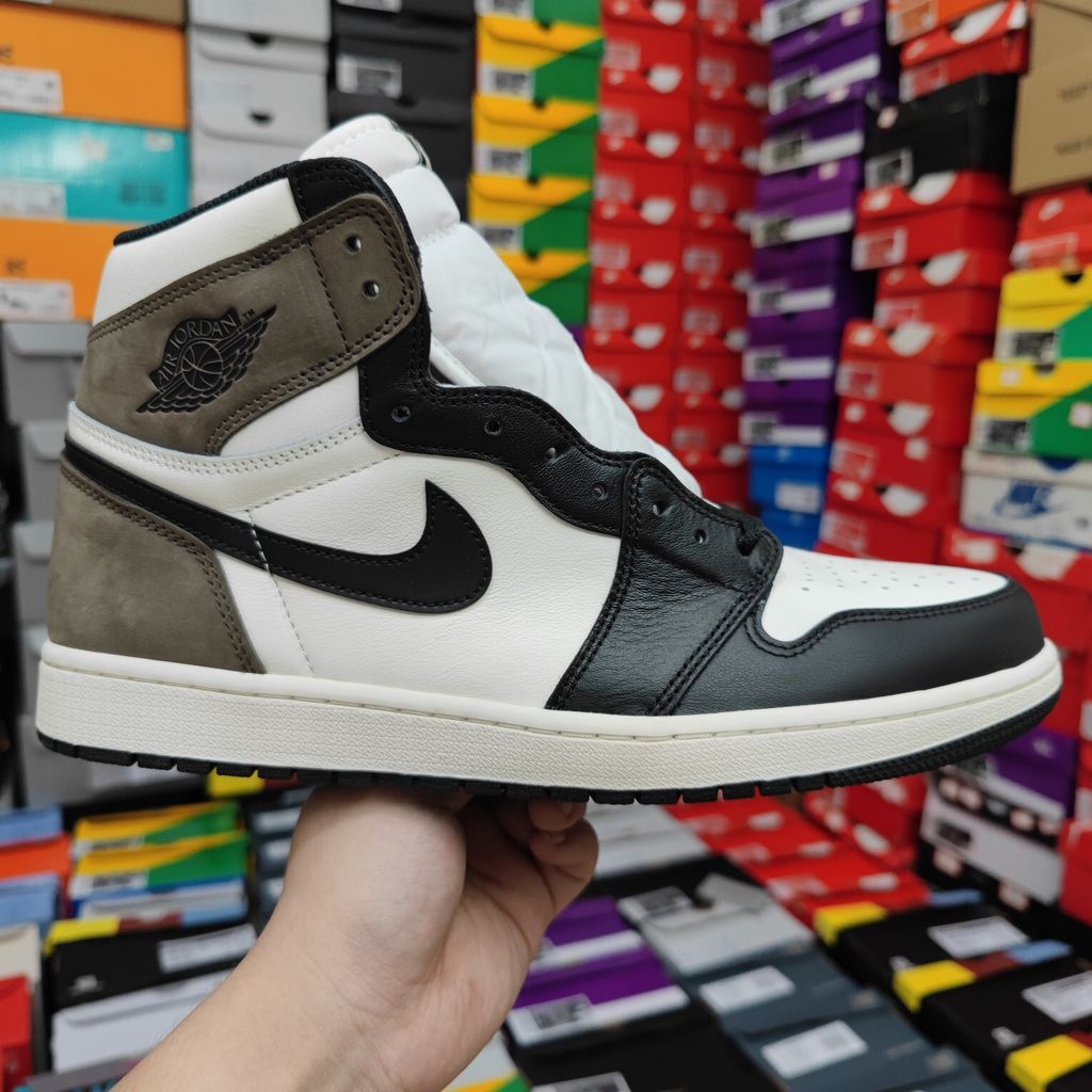 Air Jordan 1 Retro High OG high-top sneaker featuring a Sail white leather base, Black leather forefoot overlays, and Dark Mocha brown suede on the heel, SKU 555088-105.