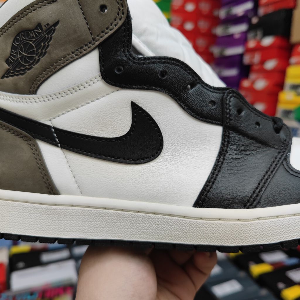 Air Jordan 1 Retro High OG high-top sneaker featuring a Sail white leather base, Black leather forefoot overlays, and Dark Mocha brown suede on the heel, SKU 555088-105.