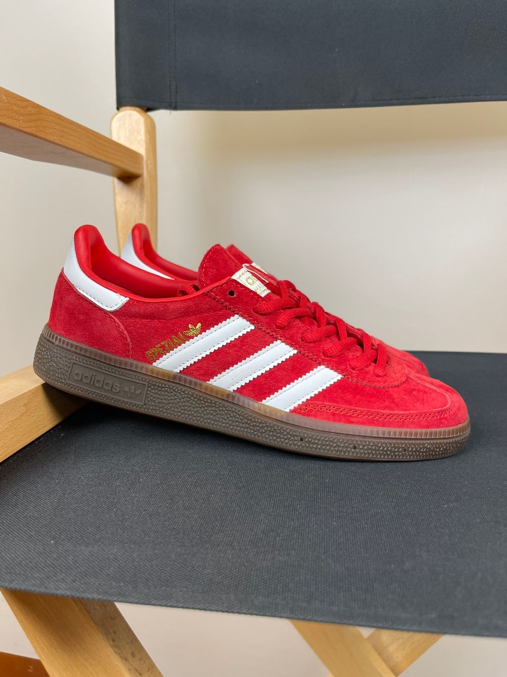 adidas Handball Spezial vintage terrace sneaker in vibrant Scarlet red suede, featuring crisp Footwear White leather Three Stripes and a classic gum rubber sole, SKU FV1227.