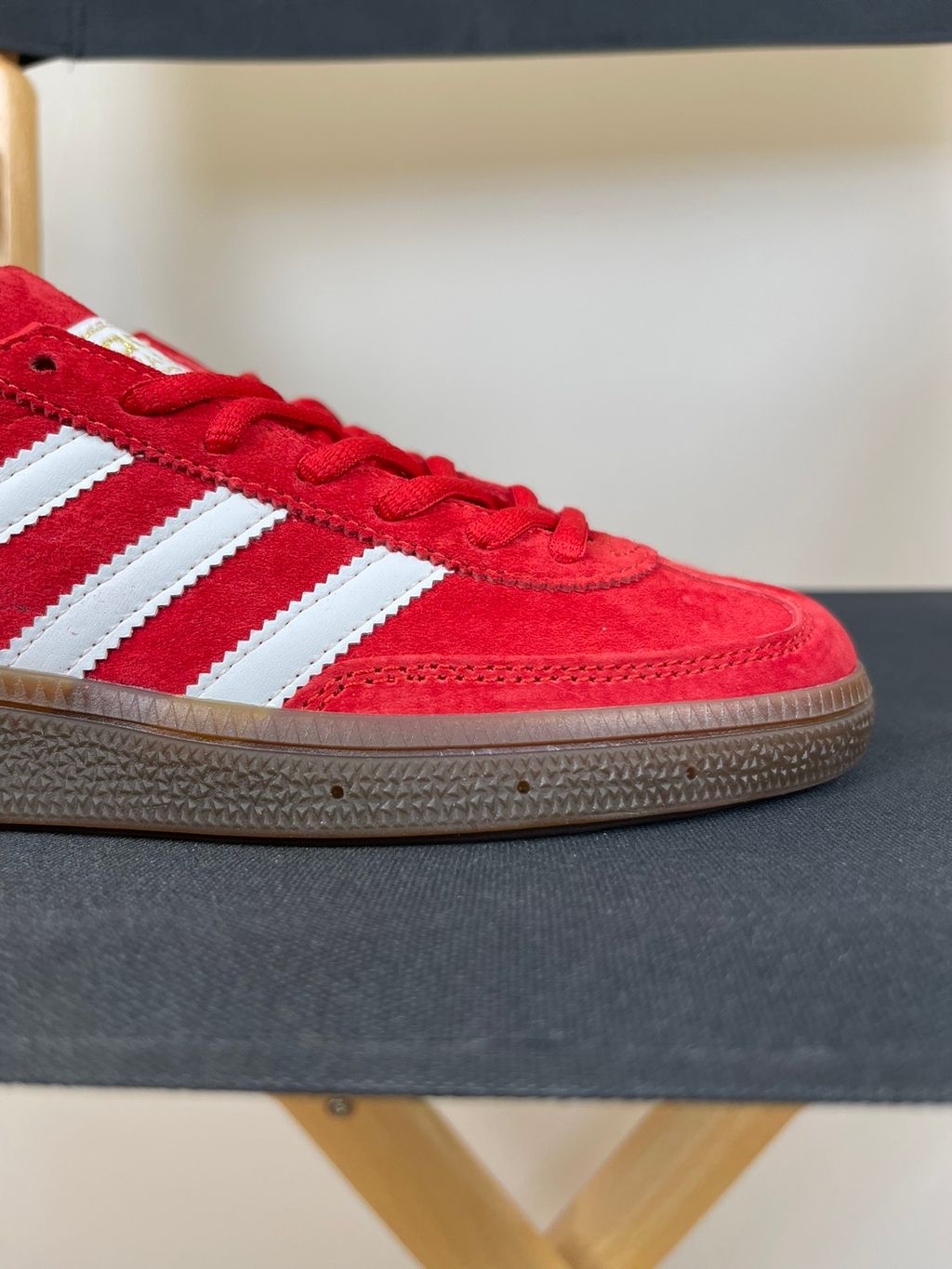 adidas Handball Spezial vintage terrace sneaker in vibrant Scarlet red suede, featuring crisp Footwear White leather Three Stripes and a classic gum rubber sole, SKU FV1227.