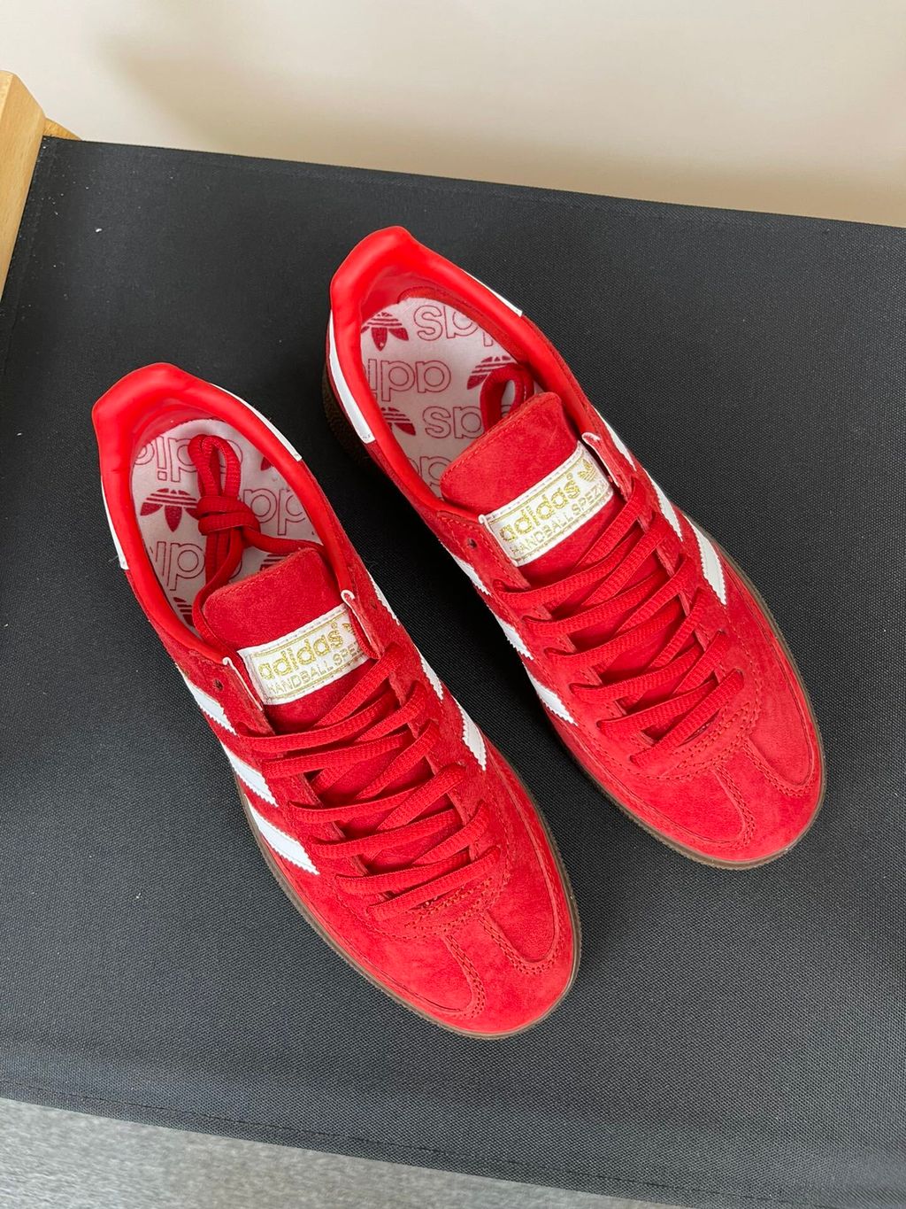 adidas Handball Spezial vintage terrace sneaker in vibrant Scarlet red suede, featuring crisp Footwear White leather Three Stripes and a classic gum rubber sole, SKU FV1227.
