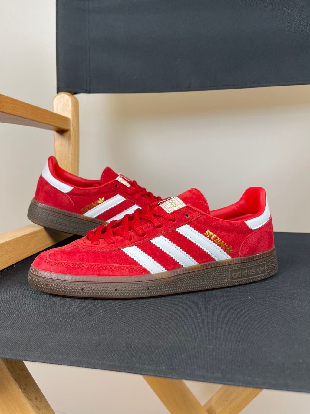 adidas Handball Spezial vintage terrace sneaker in vibrant Scarlet red suede, featuring crisp Footwear White leather Three Stripes and a classic gum rubber sole, SKU FV1227.