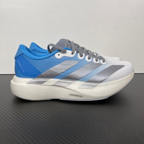 adidas Adizero Evo SL Woven marathon running shoe in a Cloud Blue and White gradient, featuring metallic silver Three Stripes and a thick Lightstrike Pro foam midsole, SKU KJ1996.