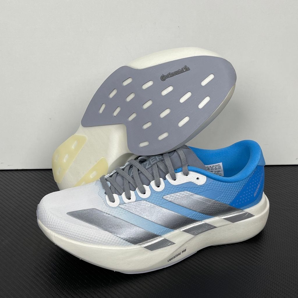 adidas Adizero Evo SL Woven marathon running shoe in a Cloud Blue and White gradient, featuring metallic silver Three Stripes and a thick Lightstrike Pro foam midsole, SKU KJ1996.