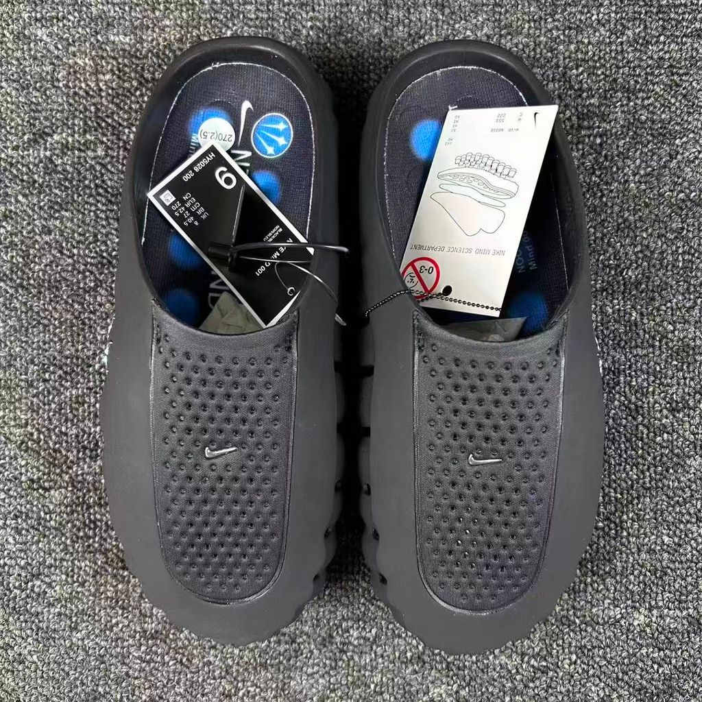 Nike x NOCTA Mind 001 premium lifestyle slide in all black, featuring a tactical, tech-wear inspired molded upper and subtle NOCTA branding.