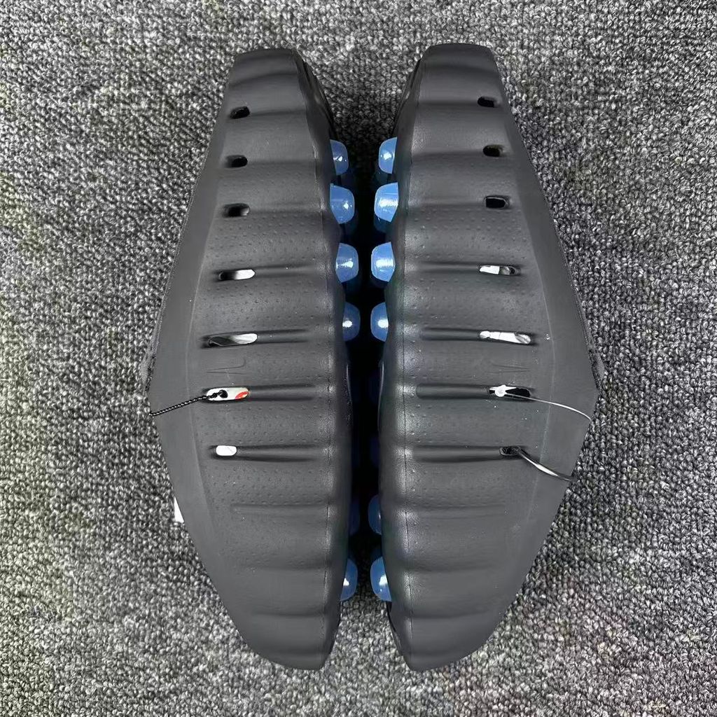 Nike x NOCTA Mind 001 premium lifestyle slide in all black, featuring a tactical, tech-wear inspired molded upper and subtle NOCTA branding.
