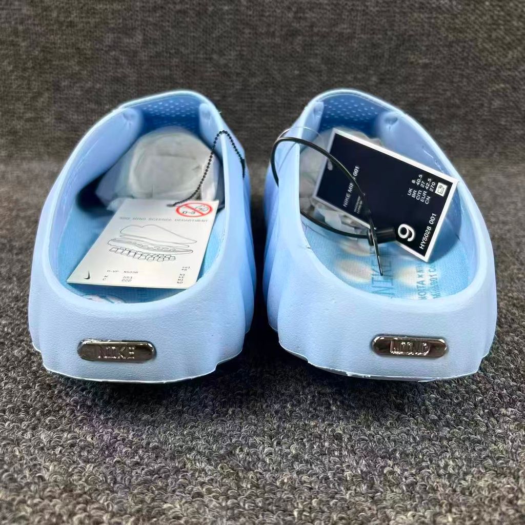 Nike x NOCTA Mind 001 premium lifestyle slide in a vibrant Ice Blue, featuring a tactical, tech-wear inspired molded upper and subtle NOCTA branding.