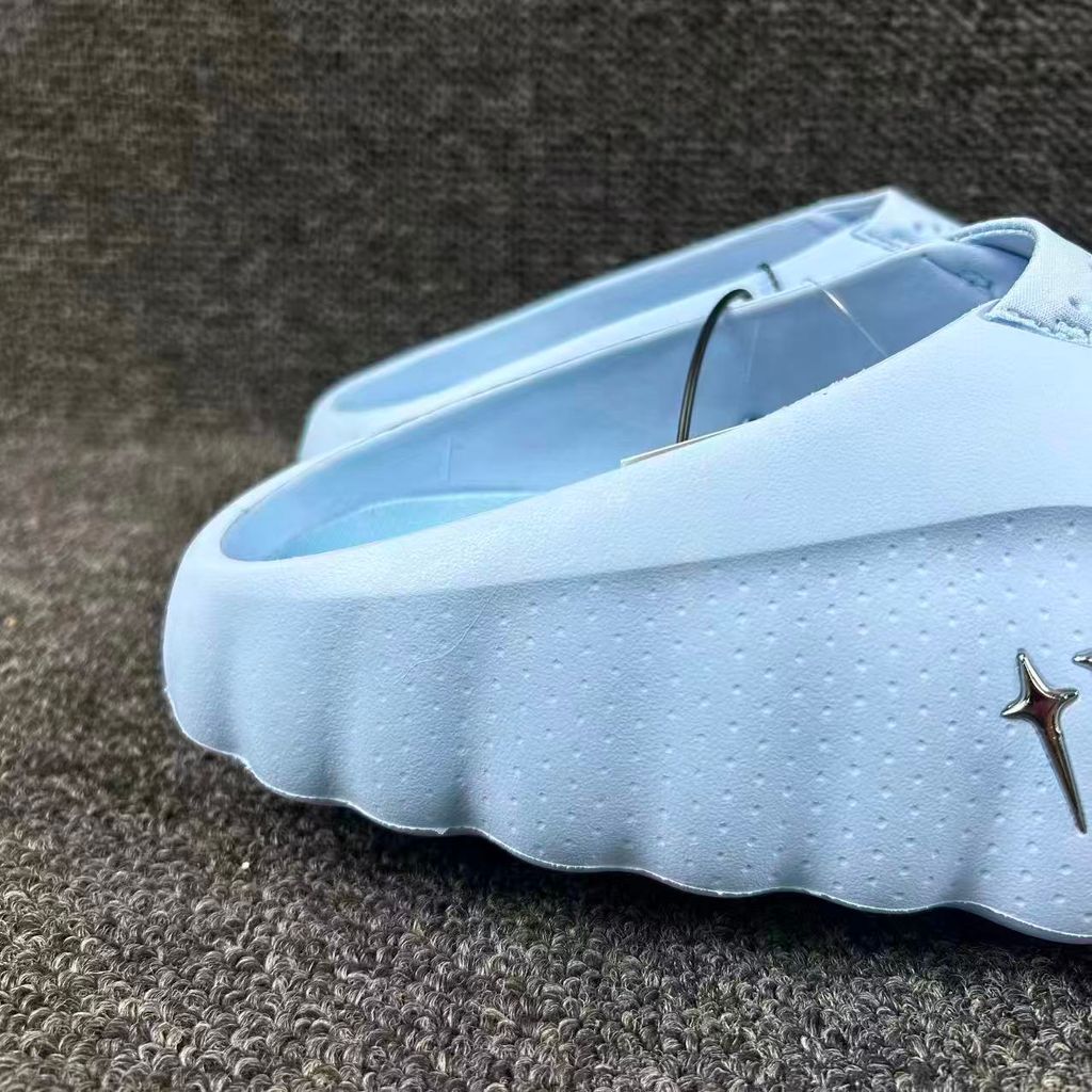 Nike x NOCTA Mind 001 premium lifestyle slide in a vibrant Ice Blue, featuring a tactical, tech-wear inspired molded upper and subtle NOCTA branding.