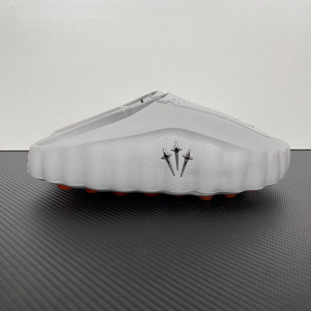 Nike x NOCTA Mind 001 premium lifestyle slide in a monochromatic light grey, featuring a tactical, tech-wear inspired molded upper and subtle NOCTA branding.
