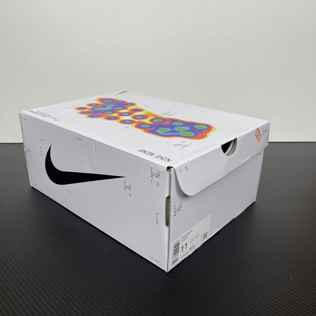 Nike x NOCTA Mind 001 premium lifestyle slide in a monochromatic light grey, featuring a tactical, tech-wear inspired molded upper and subtle NOCTA branding.