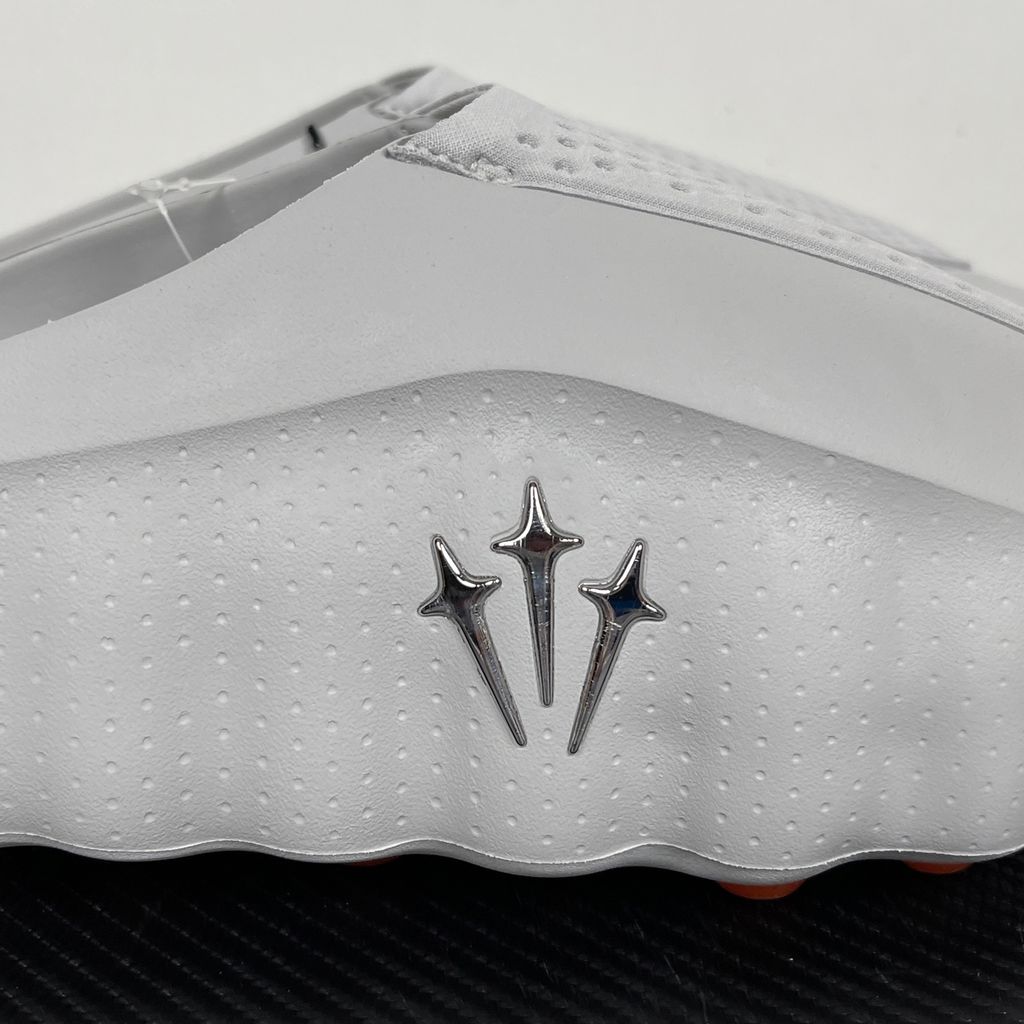 Nike x NOCTA Mind 001 premium lifestyle slide in a monochromatic light grey, featuring a tactical, tech-wear inspired molded upper and subtle NOCTA branding.