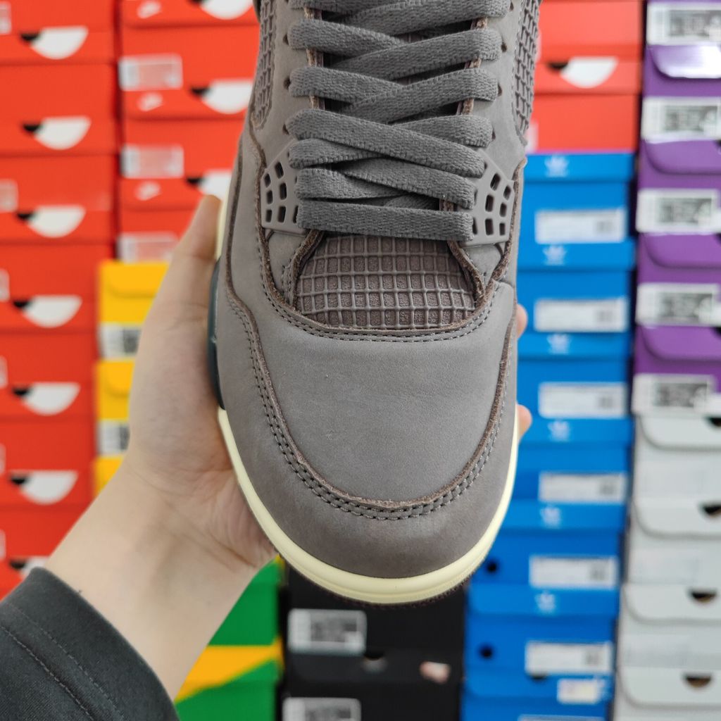 Air Jordan 4 Retro SP x A Ma Maniére sneaker featuring a monochromatic muted purple "Violet Ore" premium nubuck upper, black netting, and an aged sail midsole, SKU DV6773-220..jpg