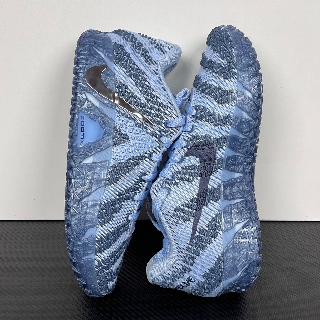 Nike Ja 3 All-Star basketball shoe in a vibrant galactic blue colorway, featuring a breathable mesh upper, iridescent silver Nike Swoosh, and a translucent icy outsole, SKU HF2794-400.