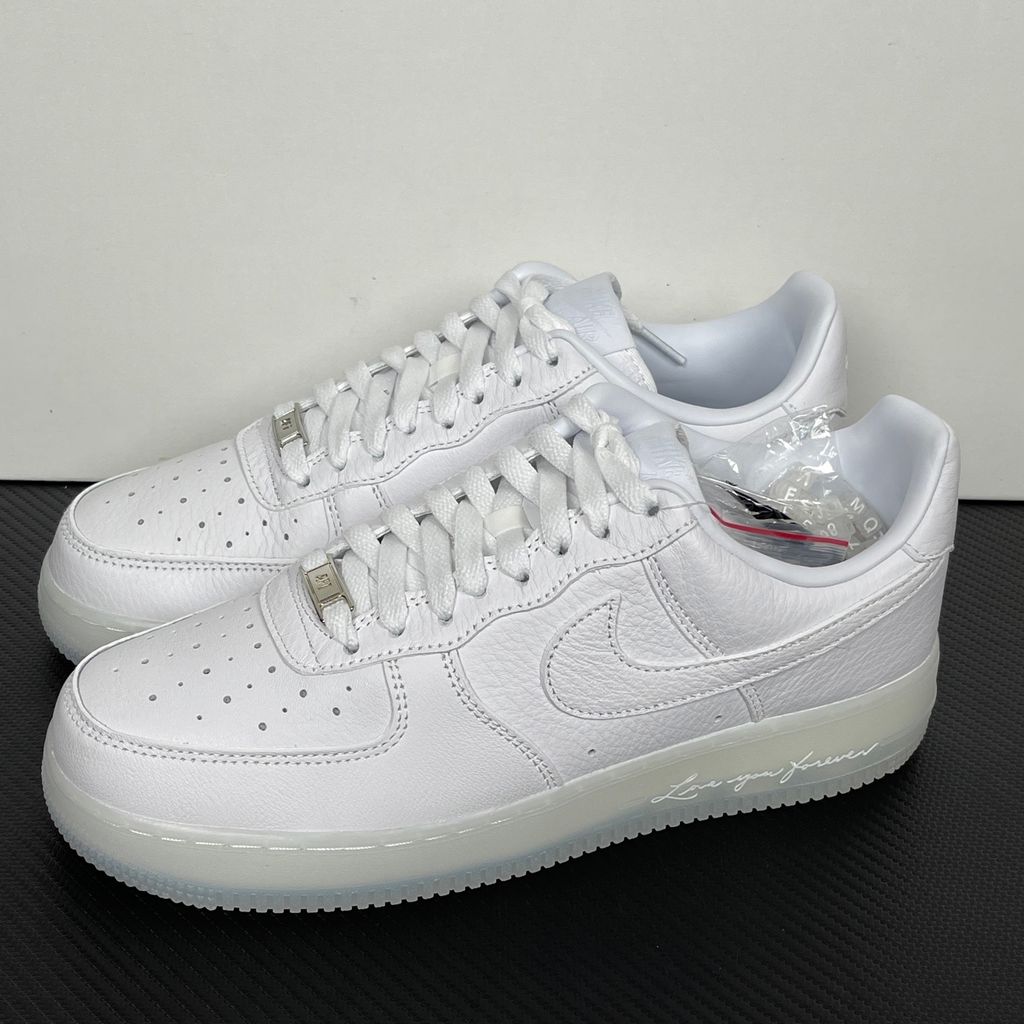 Nike Air Force 1 Low x Drake NOCTA "Certified Lover Boy" sneaker in pristine white premium leather with subtle Cobalt Tint accents and custom NOCTA heel branding, SKU CZ8065-101.
