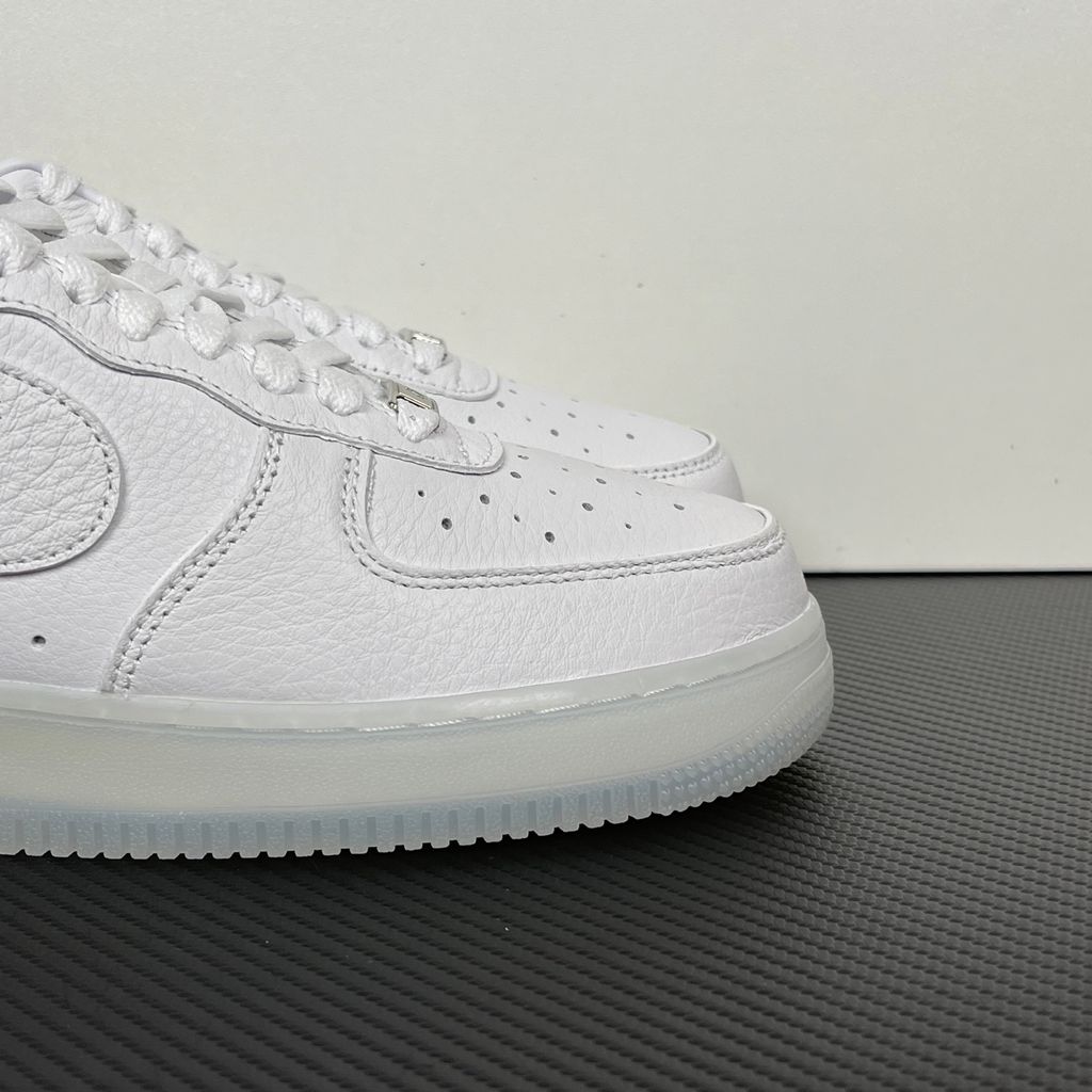 Nike Air Force 1 Low x Drake NOCTA "Certified Lover Boy" sneaker in pristine white premium leather with subtle Cobalt Tint accents and custom NOCTA heel branding, SKU CZ8065-101.