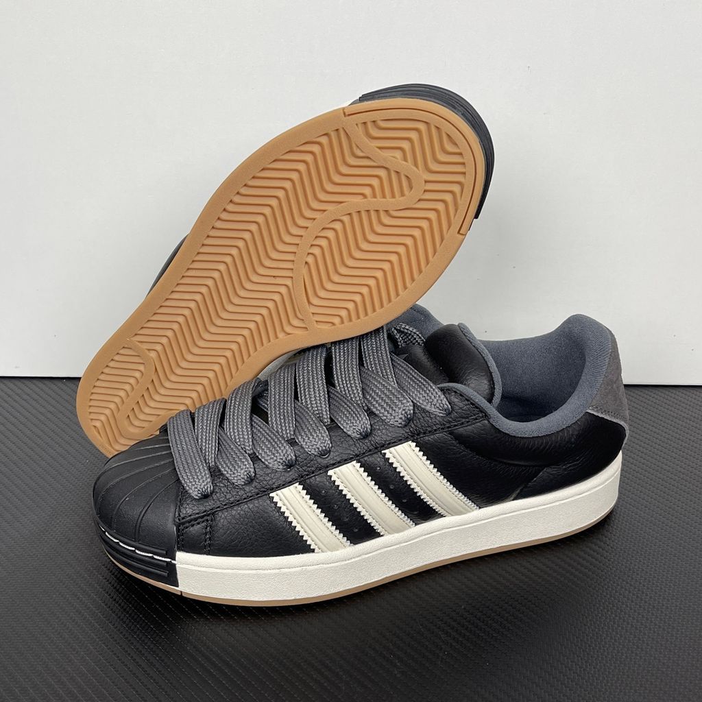 adidas Superstar St low-top sneaker featuring a unique stripe-panelled design, classic white leather upper, contrasting side stripes, and the signature rubber shell-toe, SKU KI3516.