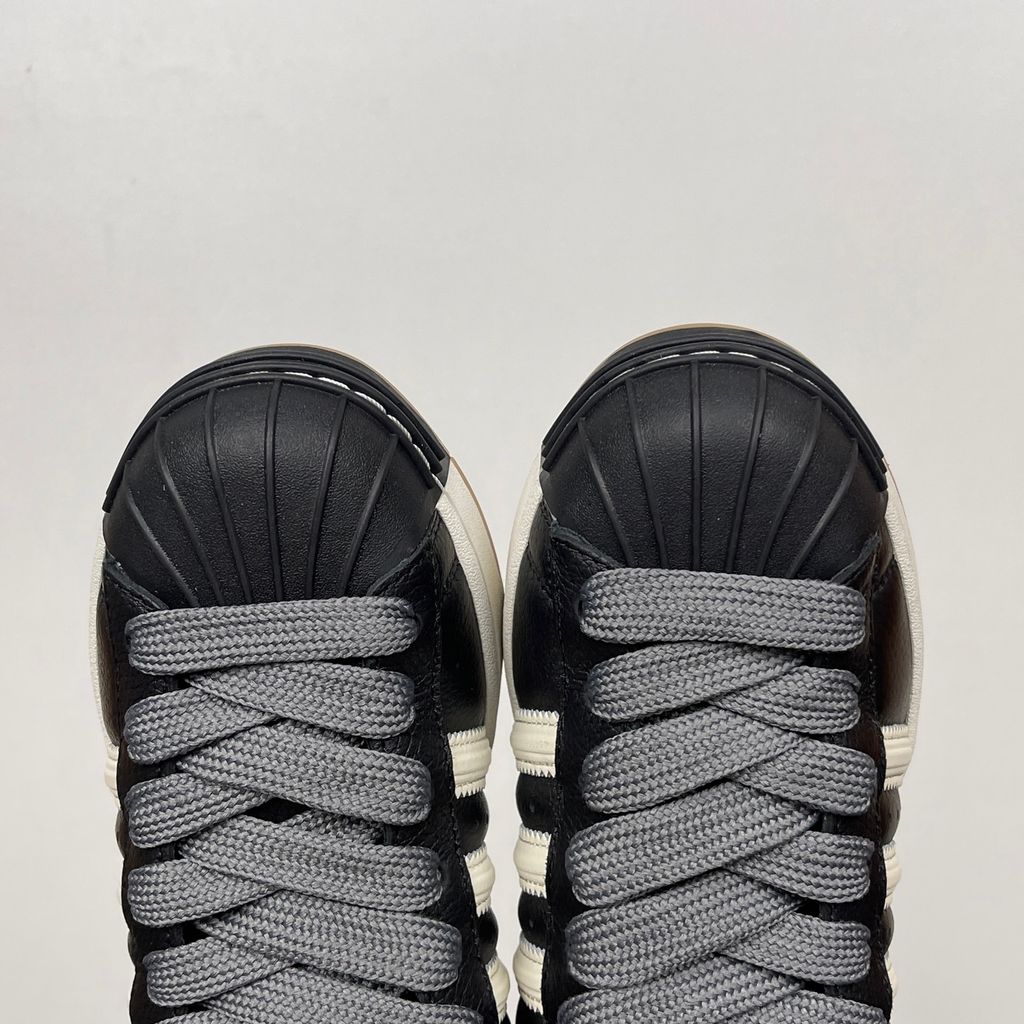adidas Superstar St low-top sneaker featuring a unique stripe-panelled design, classic white leather upper, contrasting side stripes, and the signature rubber shell-toe, SKU KI3516.