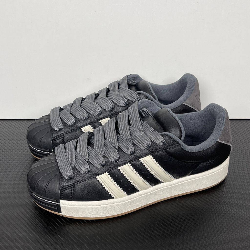 adidas Superstar St low-top sneaker featuring a unique stripe-panelled design, classic white leather upper, contrasting side stripes, and the signature rubber shell-toe, SKU KI3516.