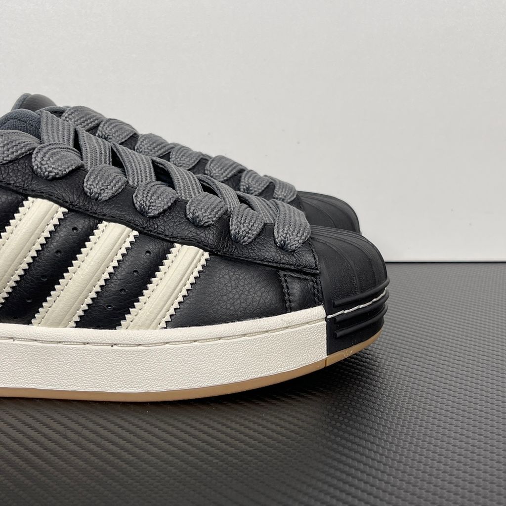 adidas Superstar St low-top sneaker featuring a unique stripe-panelled design, classic white leather upper, contrasting side stripes, and the signature rubber shell-toe, SKU KI3516.