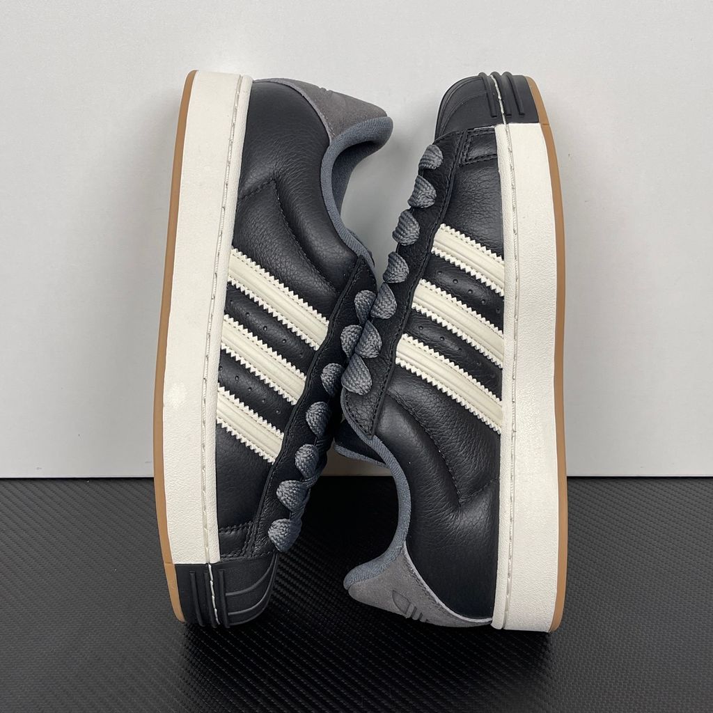 adidas Superstar St low-top sneaker featuring a unique stripe-panelled design, classic white leather upper, contrasting side stripes, and the signature rubber shell-toe, SKU KI3516.