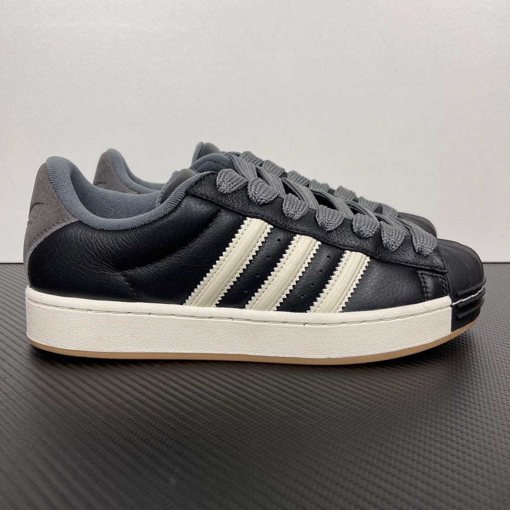 adidas Superstar St low-top sneaker featuring a unique stripe-panelled design, classic white leather upper, contrasting side stripes, and the signature rubber shell-toe, SKU KI3516.
