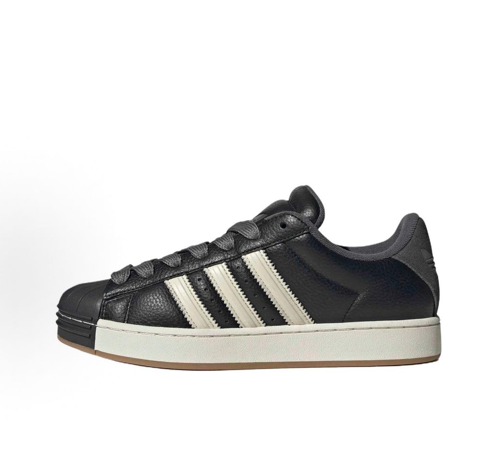 adidas Superstar St low-top sneaker featuring a unique stripe-panelled design, classic white leather upper, contrasting side stripes, and the signature rubber shell-toe, SKU KI3516.