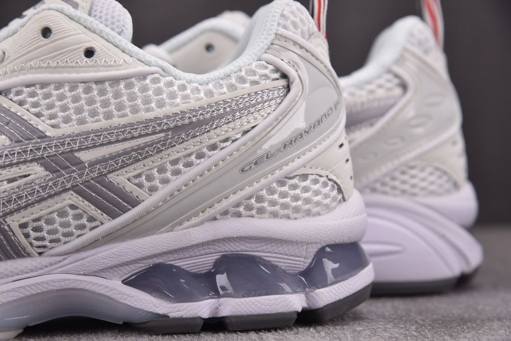 ASICS Gel-Kayano 14 x Thom Browne luxury performance sneaker in a crisp monochromatic white colorway, featuring premium leather and mesh construction, co-branded detailing, and metallic accents, SKU 1203B291-100.