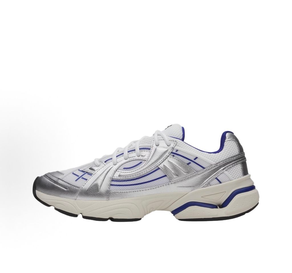 Under Armour UA Sola retro tech-runner side profile, featuring a white breathable mesh upper, dynamic metallic silver synthetic overlays, and vibrant purple accents on the midsole and collar, SKU 6005284-103.