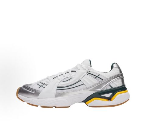 Under Armour UA Sola retro tech-runner side profile, featuring a clean white breathable mesh upper, dynamic metallic silver overlays, dark green collar lining, bright yellow midsole accents, and a classic gum rubber outsole, SKU 6005284-104.