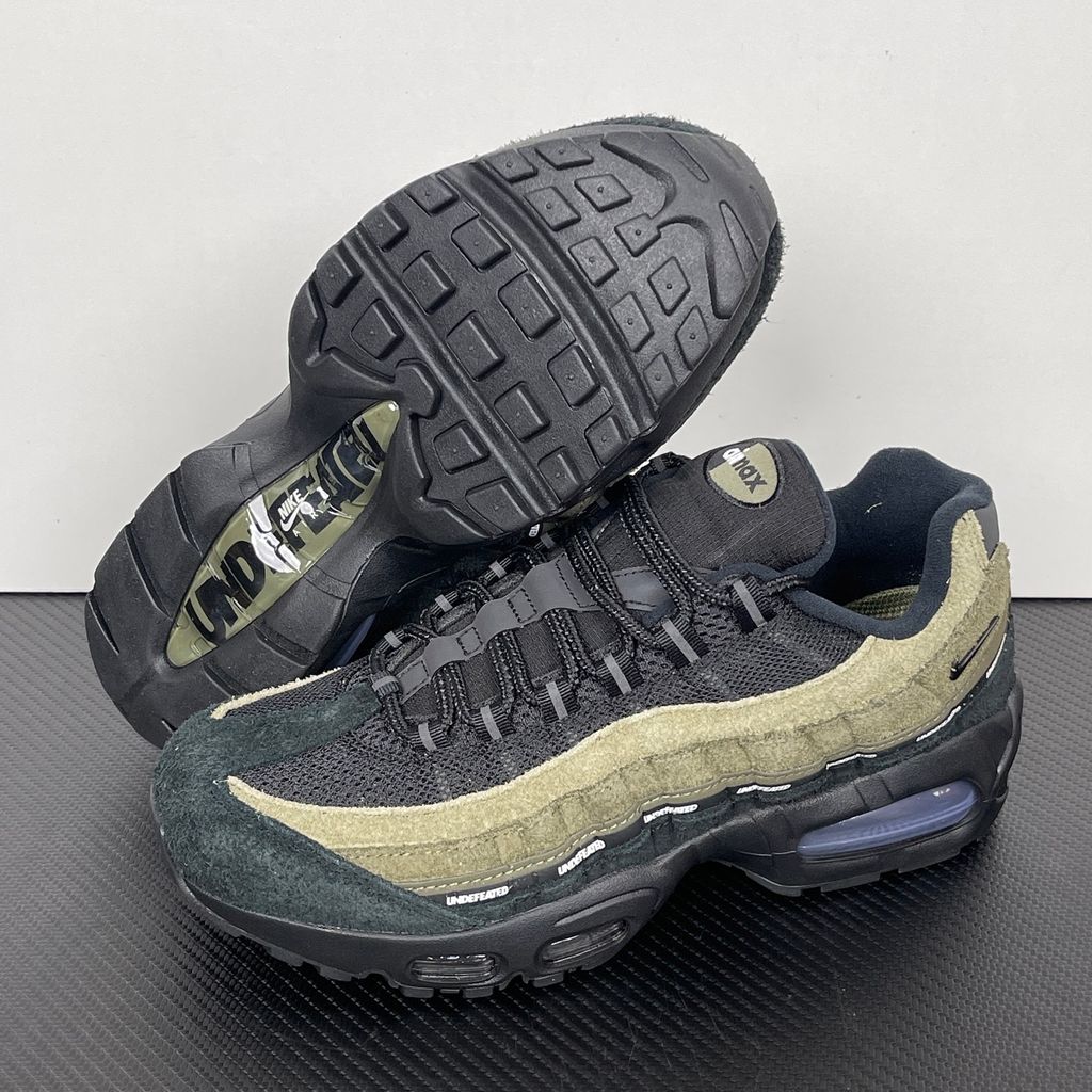 Nike Air Max 95 SP x Undefeated "Geo La Brea" sneaker featuring a layered gradient upper in Medium Olive and dark green tones, premium suede construction, and a contrasting black midsole, SKU IB4523-200.