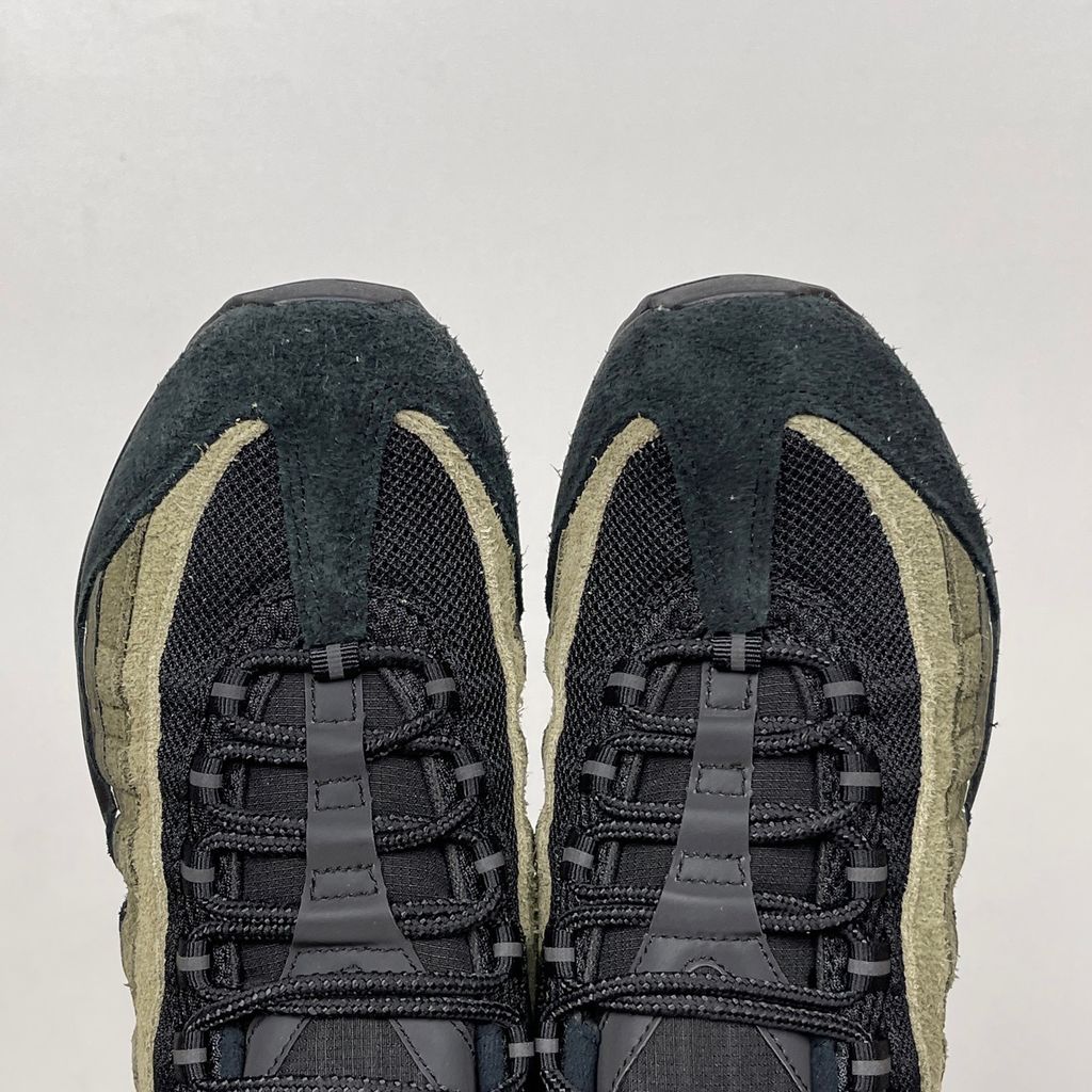 Nike Air Max 95 SP x Undefeated "Geo La Brea" sneaker featuring a layered gradient upper in Medium Olive and dark green tones, premium suede construction, and a contrasting black midsole, SKU IB4523-200.