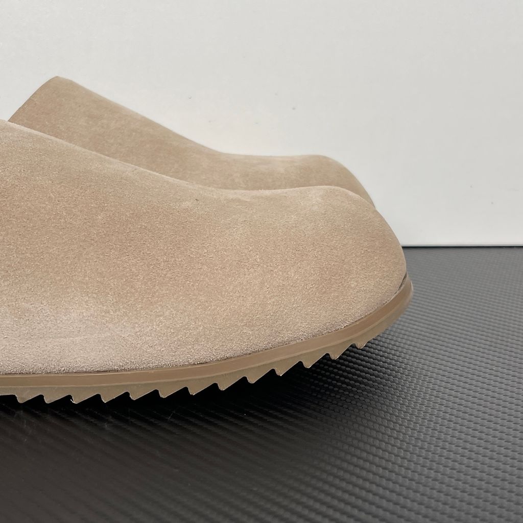 Side profile of the Rick Owens Mainline premium suede closed-toe Megalace Mule in Granola Brown, featuring a minimalist silhouette and textured finish.