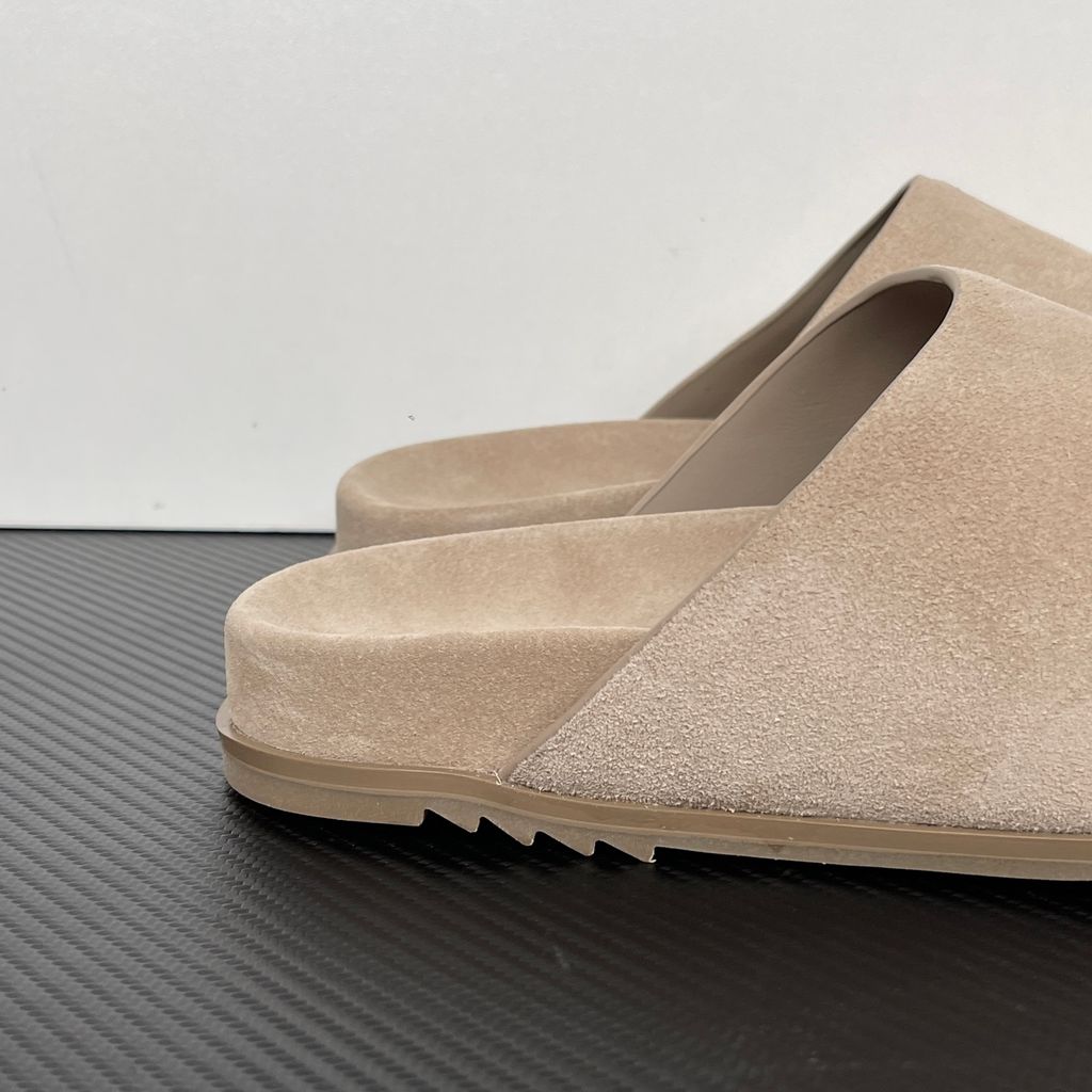 Side profile of the Rick Owens Mainline premium suede closed-toe Megalace Mule in Granola Brown, featuring a minimalist silhouette and textured finish.