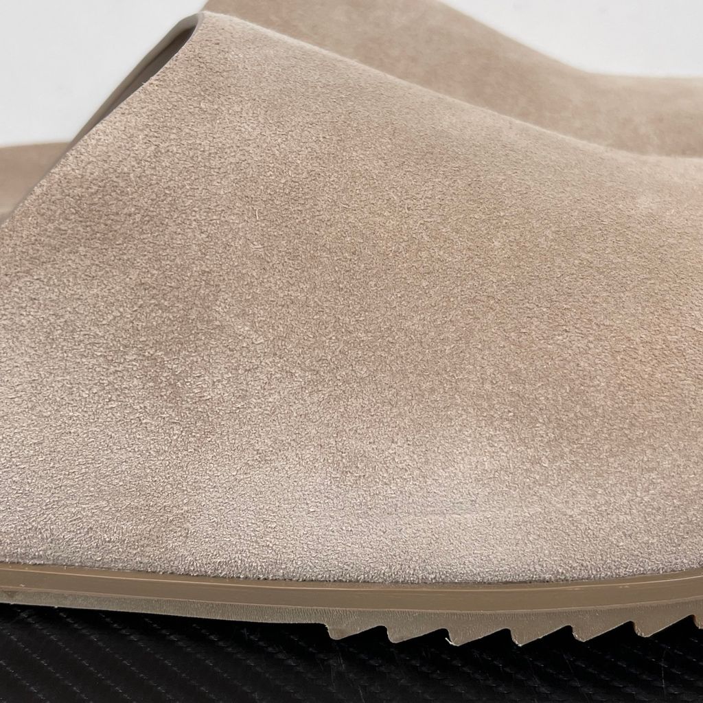 Side profile of the Rick Owens Mainline premium suede closed-toe Megalace Mule in Granola Brown, featuring a minimalist silhouette and textured finish.