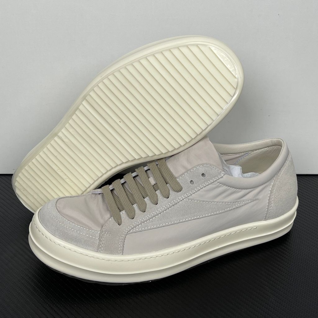Side profile of the Rick Owens Mainline Vintage Sneaks in Pearl/Milk, featuring a sleek low-top silhouette with luxurious silk-nylon and suede spliced paneling, and a thick cream-colored outsole.