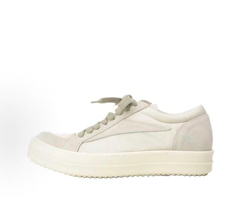 Side profile of the Rick Owens Mainline Vintage Sneaks in Pearl/Milk, featuring a sleek low-top silhouette with luxurious silk-nylon and suede spliced paneling, and a thick cream-colored outsole.